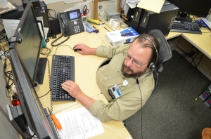 Tate Belden works on system maintenance Wednesday from his desk in Information Services. He is one of 31 IS employees who keep WMC running smoothly -- technologically speaking. 
